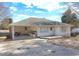 White Ranch style home with covered patio, driveway, and a large backyard at 830 Forrest St, Roswell, GA 30075