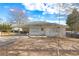 White Ranch style home with mature trees, covered porch and a spacious yard at 830 Forrest St, Roswell, GA 30075