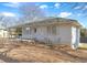 White Ranch style home with covered porch, mature trees and a large yard at 830 Forrest St, Roswell, GA 30075
