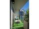 Private balcony with city views, artificial turf, and seating for two at 1280 W Peachtree Nw St # 2207, Atlanta, GA 30309