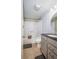 Clean bathroom with tub shower, granite vanity, and decorative wall paper at 1280 W Peachtree Nw St # 2207, Atlanta, GA 30309