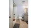 Clean bathroom with tub shower, granite vanity, and decorative wall paper at 1280 W Peachtree Nw St # 2207, Atlanta, GA 30309