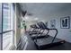 Cardio area with treadmills and large windows at 1280 W Peachtree Nw St # 2207, Atlanta, GA 30309