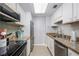 Modern kitchen with granite countertops and stainless steel appliances at 1280 W Peachtree Nw St # 2207, Atlanta, GA 30309
