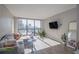 Modern living room with hardwood floors and city views at 1280 W Peachtree Nw St # 2207, Atlanta, GA 30309