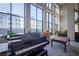 Elegant lobby with grand piano, comfortable seating, and large windows at 1280 W Peachtree Nw St # 2207, Atlanta, GA 30309