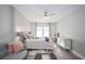 Spacious bedroom with king-size bed, sitting area, and ceiling fan at 1280 W Peachtree Nw St # 2207, Atlanta, GA 30309