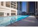 Resort-style pool with plenty of lounge chairs at 1280 W Peachtree Nw St # 2207, Atlanta, GA 30309