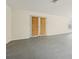 Spacious unfinished basement with double doors leading to the outside, concrete floor and neutral painted walls at 245 London Ln, Hiram, GA 30141