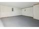 The unfinished basement features a concrete floor and wall with exposed utilities at 245 London Ln, Hiram, GA 30141