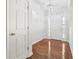 Bright foyer with hardwood floors and a modern chandelier at 245 London Ln, Hiram, GA 30141