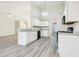 Bright kitchen featuring white cabinets, stainless appliances, and modern countertops at 245 London Ln, Hiram, GA 30141