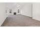 Spacious living room featuring a fireplace and neutral carpet at 245 London Ln, Hiram, GA 30141