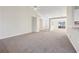 Spacious living room with neutral carpet and a view into the foyer at 245 London Ln, Hiram, GA 30141