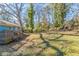 Large backyard with mature trees and grassy area at 3024 Catalina Dr, Decatur, GA 30032