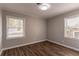 Well-lit bedroom with two windows and hardwood floors at 3024 Catalina Dr, Decatur, GA 30032