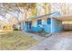 Front view of a blue house with a driveway and landscaping at 3024 Catalina Dr, Decatur, GA 30032