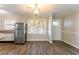 View of kitchen, dining area, and entryway at 3024 Catalina Dr, Decatur, GA 30032