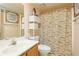 Bathroom with shower, toilet and shelving unit at 3251 Hunters Crossing Pt, Lithonia, GA 30038