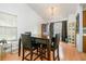 Dining room with dark wood table and chairs, hardwood floors, and a china cabinet at 3251 Hunters Crossing Pt, Lithonia, GA 30038
