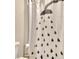 Bathroom with shower and black and white shower curtain at 7760 Pleasant Hollow Ln, Cumming, GA 30041