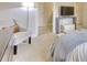 Bright bedroom with TV and cozy armchair at 7760 Pleasant Hollow Ln, Cumming, GA 30041