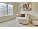 Relaxing bedroom with a comfortable armchair and large window at 7760 Pleasant Hollow Ln, Cumming, GA 30041