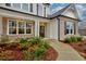 Inviting front entrance with brick columns and a walkway at 7760 Pleasant Hollow Ln, Cumming, GA 30041