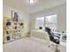 Bright home office features built-in shelving and large window at 7760 Pleasant Hollow Ln, Cumming, GA 30041