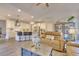 Open concept kitchen and living room, featuring stainless steel appliances and a large island at 7760 Pleasant Hollow Ln, Cumming, GA 30041