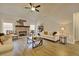 Spacious living room with a brick fireplace and hardwood floors at 7760 Pleasant Hollow Ln, Cumming, GA 30041