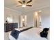 Bright main bedroom featuring a ceiling fan and ample closet space at 7760 Pleasant Hollow Ln, Cumming, GA 30041