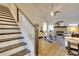 Elegant staircase with white railings and dark wood steps at 7760 Pleasant Hollow Ln, Cumming, GA 30041