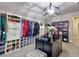Luxurious walk-in closet with custom built-ins at 7760 Pleasant Hollow Ln, Cumming, GA 30041