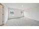 Spacious bedroom with neutral carpeting, light walls and two windows at 701 Lily Blossom Path Path, Lawrenceville, GA 30045