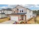 Attractive two-story home with stone accents and a two-car garage at 701 Lily Blossom Path Path, Lawrenceville, GA 30045