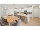 Eat-in kitchen with white cabinets, a center island, and dining table at 701 Lily Blossom Path Path, Lawrenceville, GA 30045