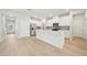 Bright kitchen with white cabinets, stainless appliances, and large island at 701 Lily Blossom Path Path, Lawrenceville, GA 30045