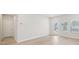 Spacious living room featuring hardwood floors and a back patio door at 701 Lily Blossom Path Path, Lawrenceville, GA 30045