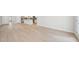 Open living area with hardwood floors and view into the kitchen at 701 Lily Blossom Path Path, Lawrenceville, GA 30045