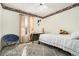 Cozy bedroom with a bed, chair, and window at 1501 Old John Ward Sw Rd, Marietta, GA 30064