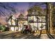 Two-story house with attached two-car garage and deck, surrounded by trees at 1501 Old John Ward Sw Rd, Marietta, GA 30064