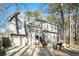 Gray two-story house with a double garage and deck at 1501 Old John Ward Sw Rd, Marietta, GA 30064
