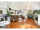 Living room with hardwood floors, stone fireplace, and a hammock at 1501 Old John Ward Sw Rd, Marietta, GA 30064