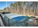 Two tennis courts with chain link fence at 1501 Old John Ward Sw Rd, Marietta, GA 30064