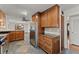 Kitchen features stainless steel appliances and ample wood cabinetry at 824 Cinderella Way, Decatur, GA 30033