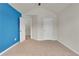 Bedroom with blue accent wall and ceiling fan at 1354 Slate Bend Dr, Dacula, GA 30019