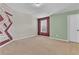 Bedroom with an accent wall and neutral carpet at 1354 Slate Bend Dr, Dacula, GA 30019
