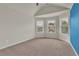 Bright bedroom featuring bay windows and blue accent wall at 1354 Slate Bend Dr, Dacula, GA 30019