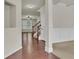 Two-story foyer with hardwood floors, staircase, and neutral color palette at 1354 Slate Bend Dr, Dacula, GA 30019